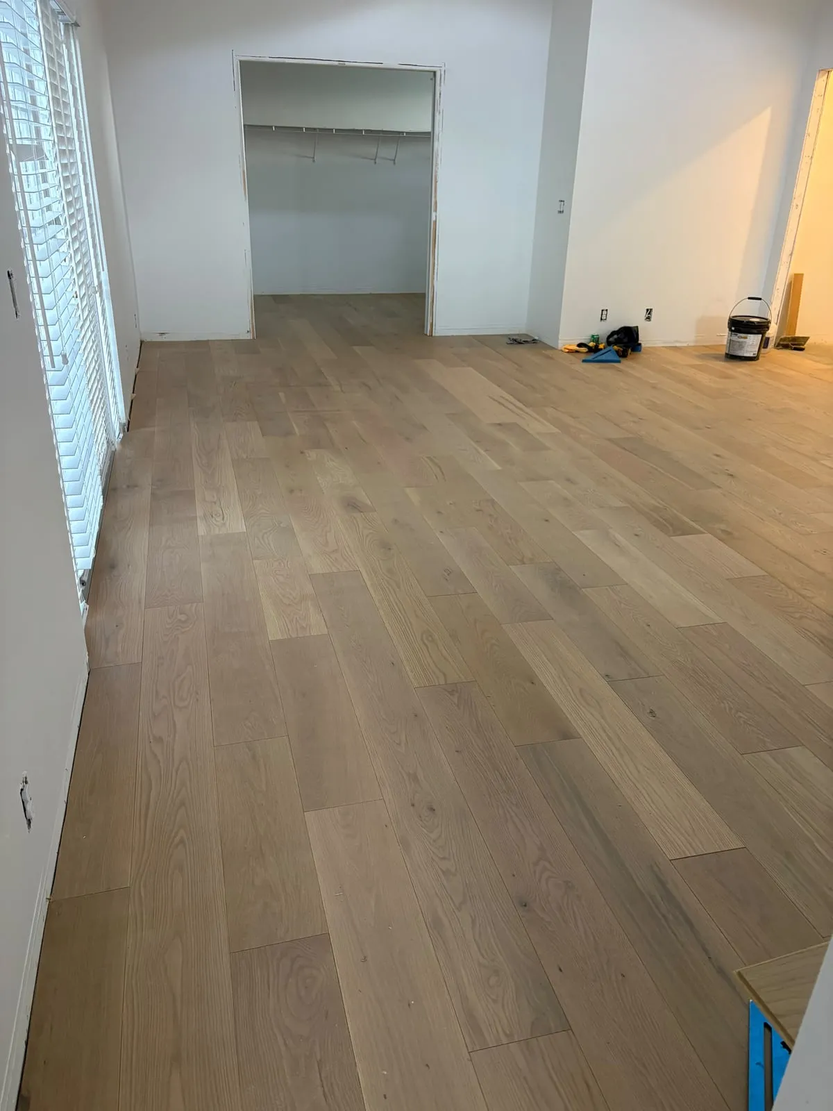 Wide plank light hardwood floor in a bedroom